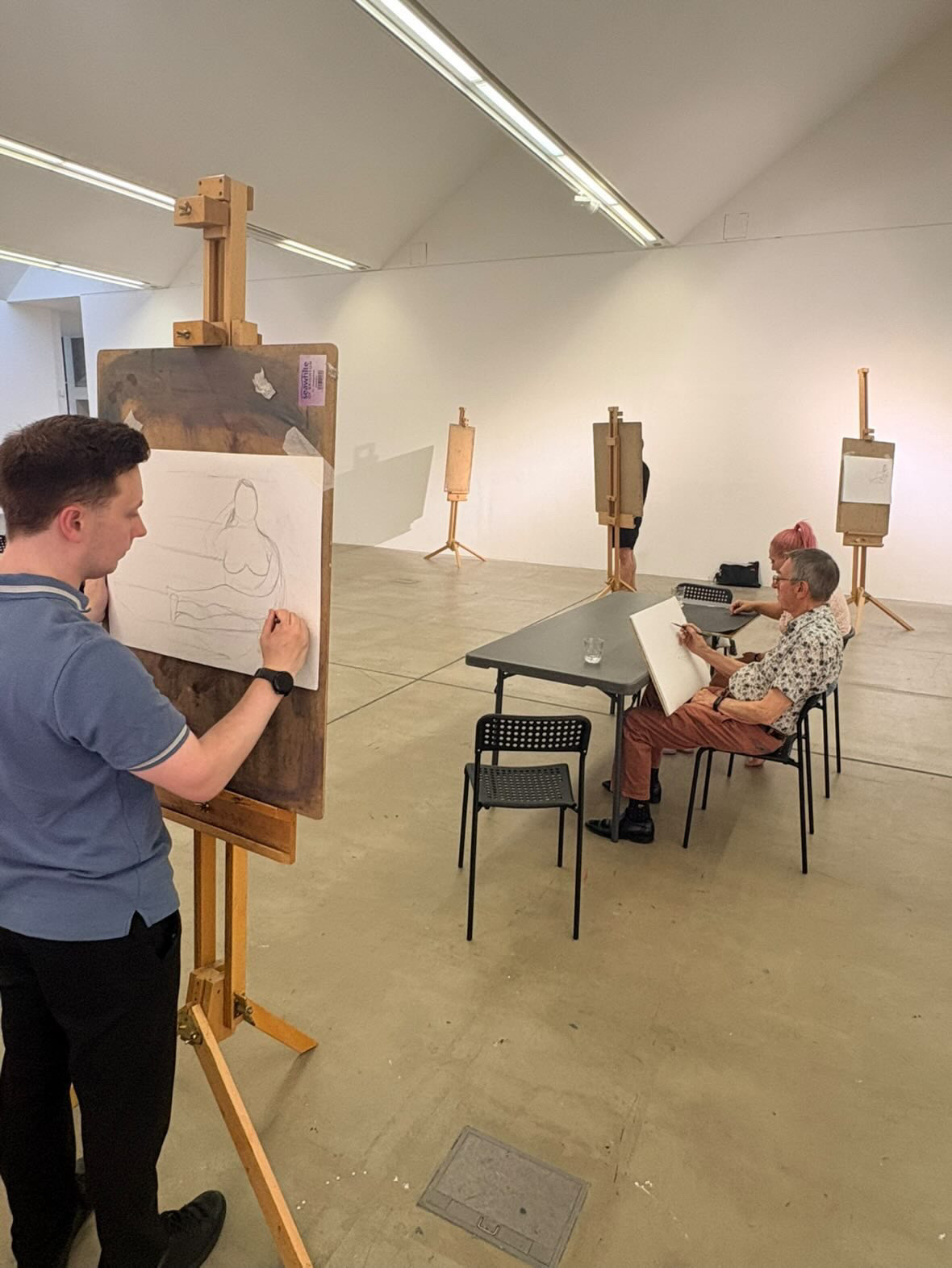Drawing at an easel during a session